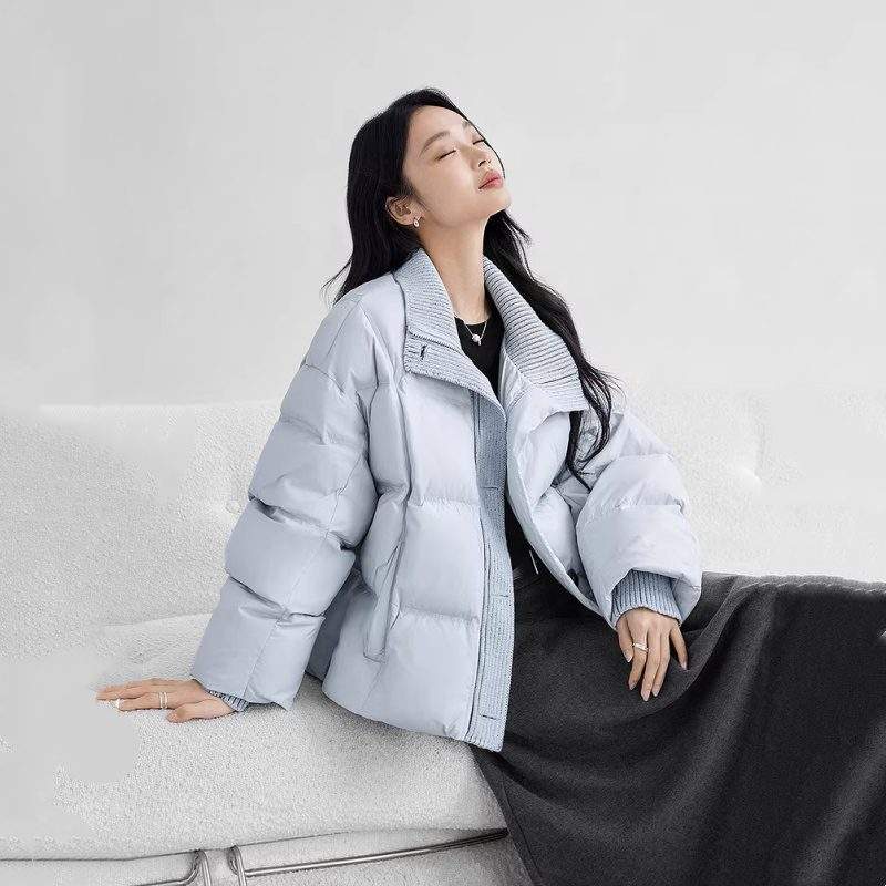 Woman wearing a light blue down winter coat